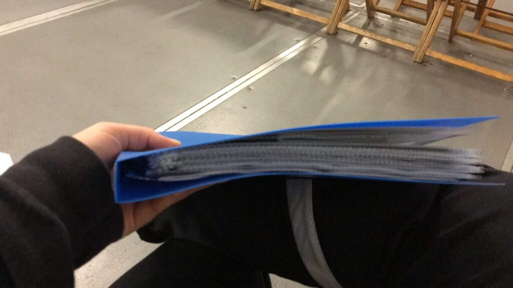 blue binder full of paper