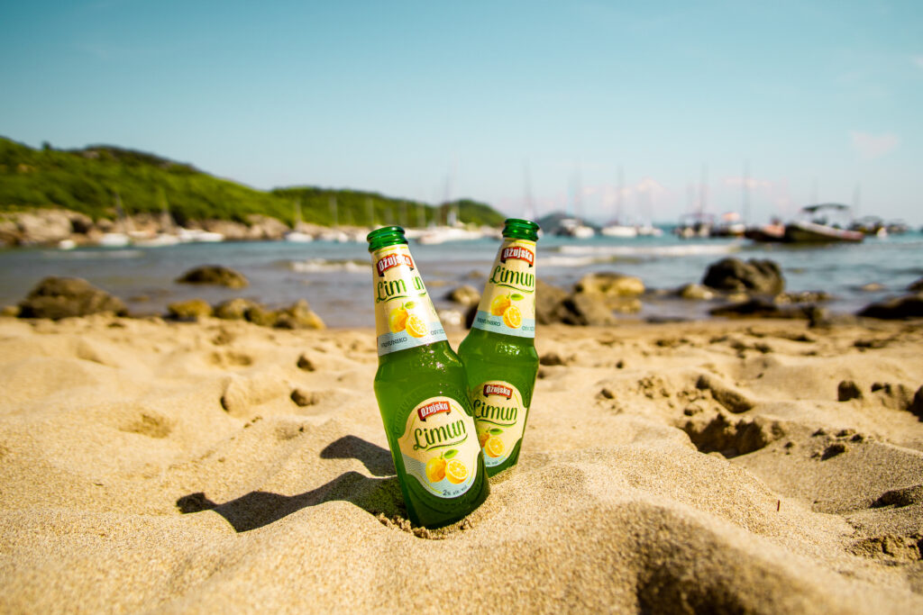 beers in sand on the beach
