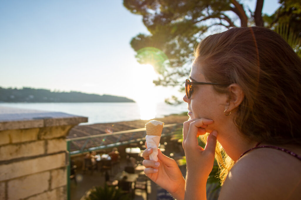 woman enjoying ice cream on lopud island croatia