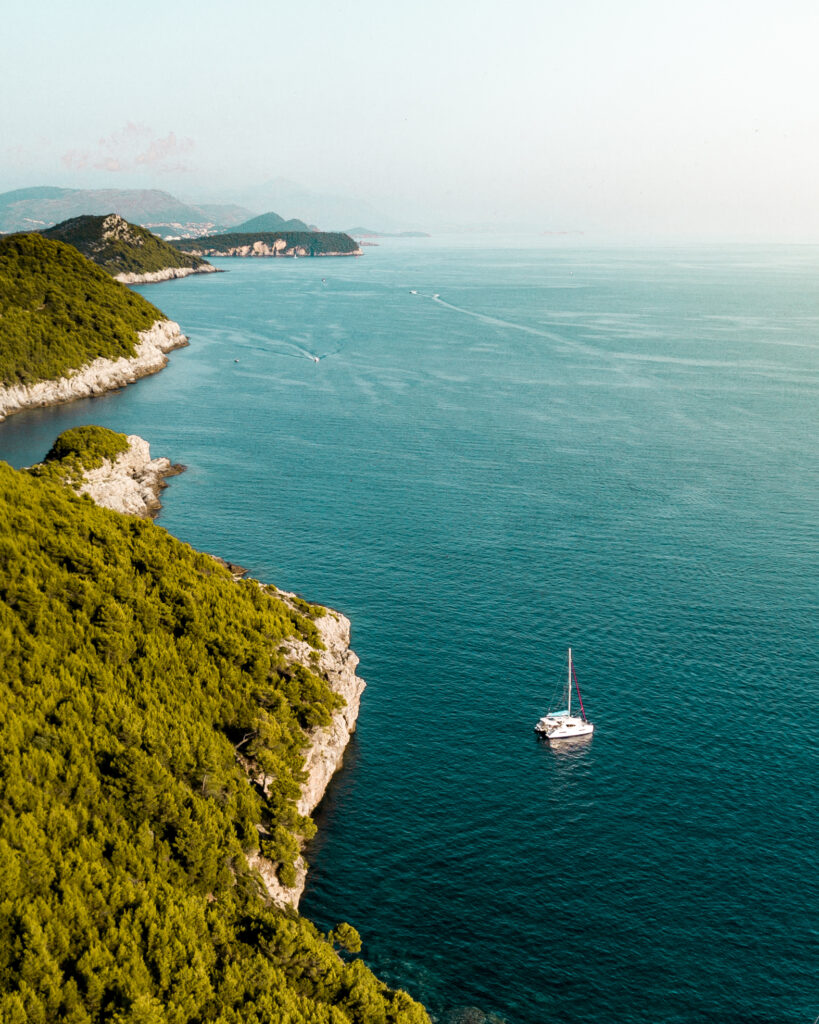 lopud coastline and sailboat from above