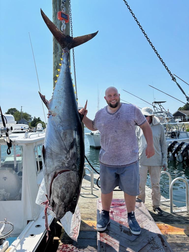 fisher with a large bluefin tuna