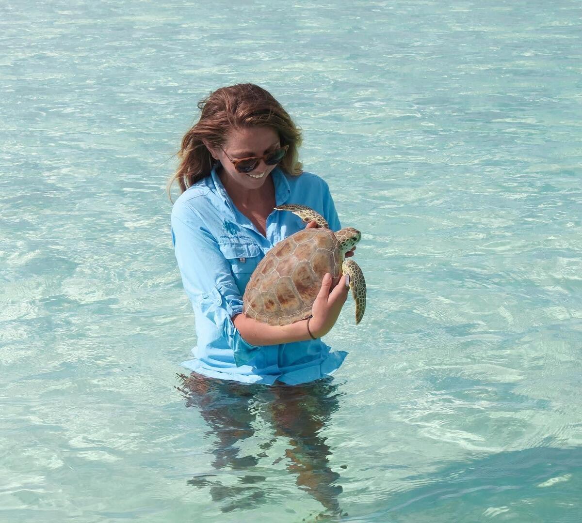 dr liberty boyd in water with sea turtle